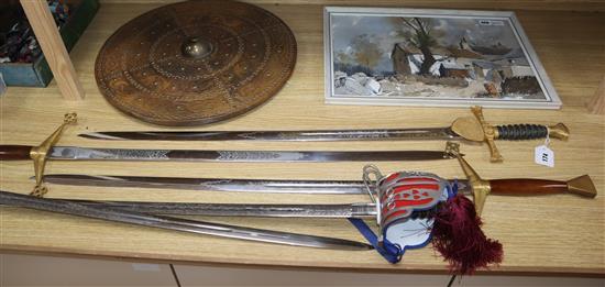 Five various theatrical swords and a shield